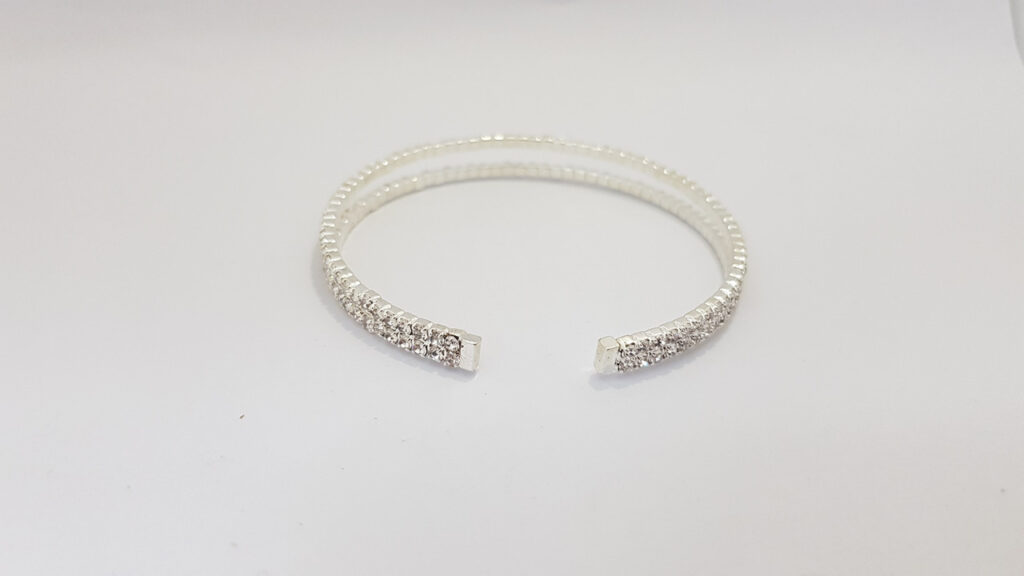 Браслет жіночий сріблястого кольору з кристалами ширина 10 мм 2 ряди каменів