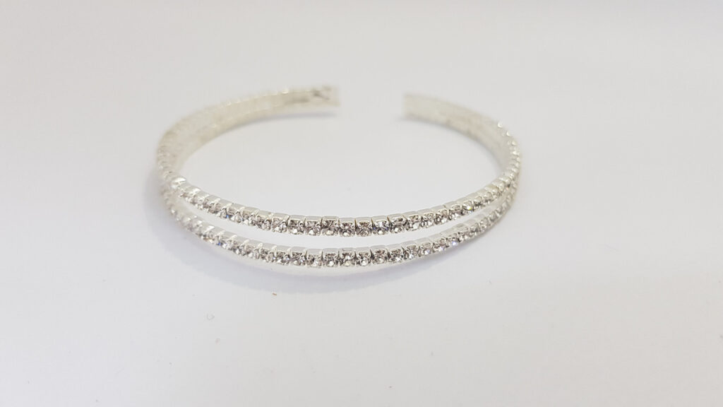 Браслет жіночий сріблястого кольору з кристалами ширина 10 мм 2 ряди каменів