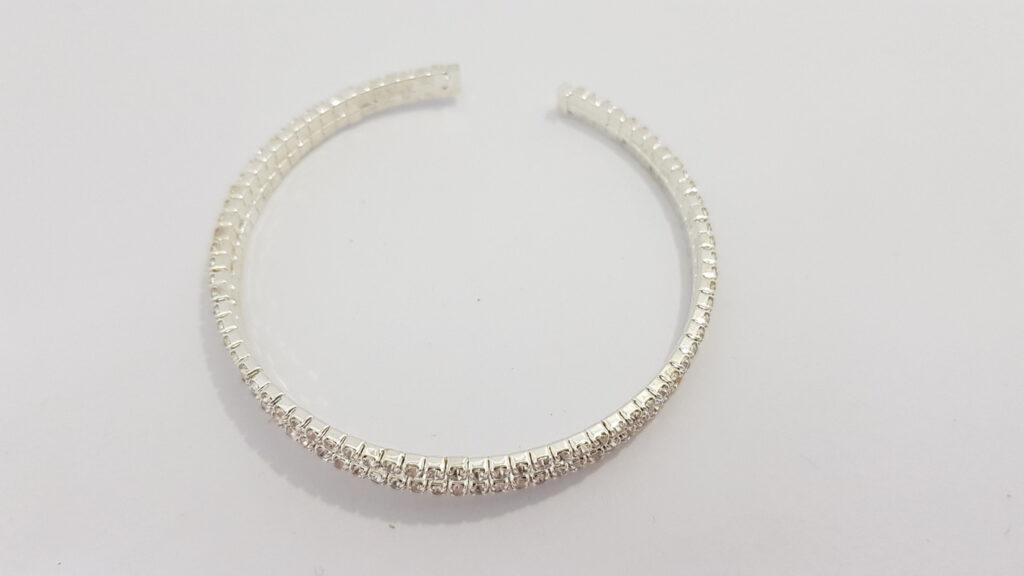 Браслет жіночий сріблястого кольору з кристалами ширина 10 мм 2 ряди каменів