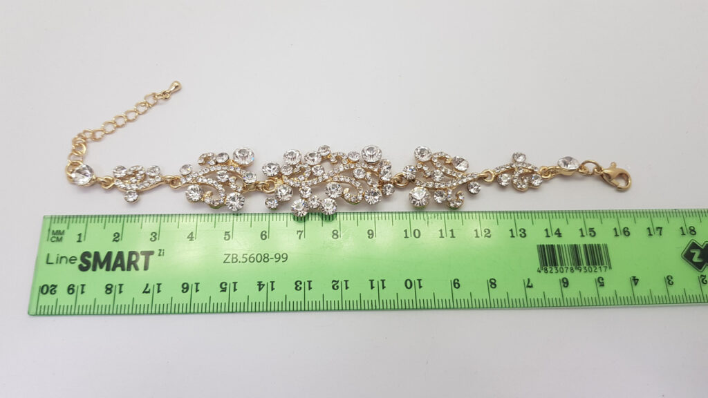 Браслет жіночий ажурний золотистий з каменями ширина 20 мм