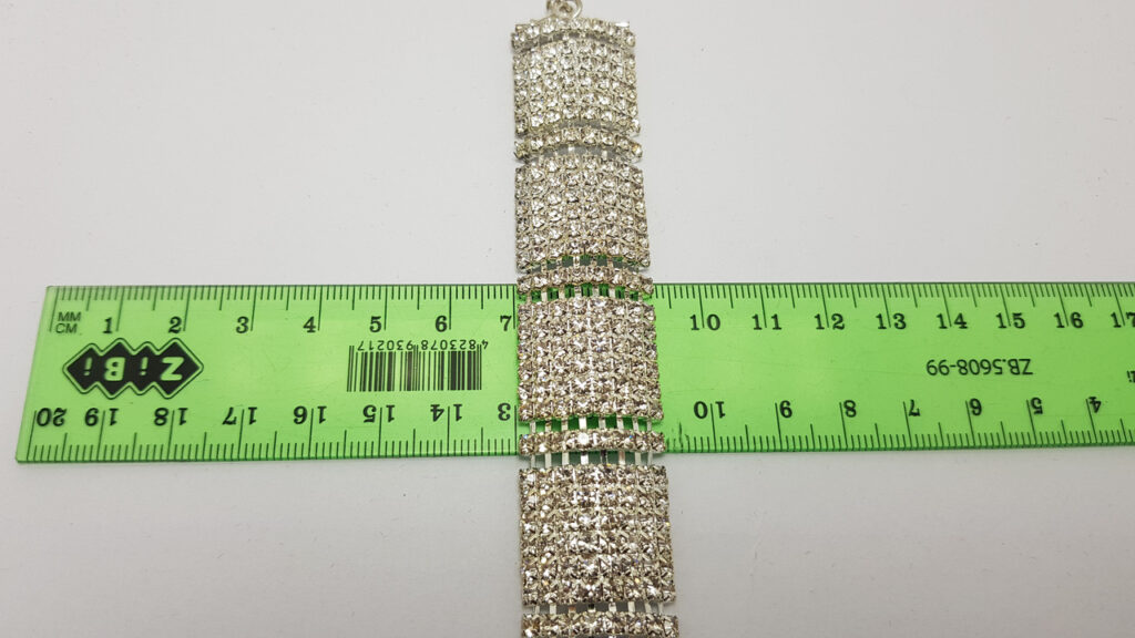 Браслет жіночий сріблястий з білими кристалами ширина 23 мм 8 рядів каменів