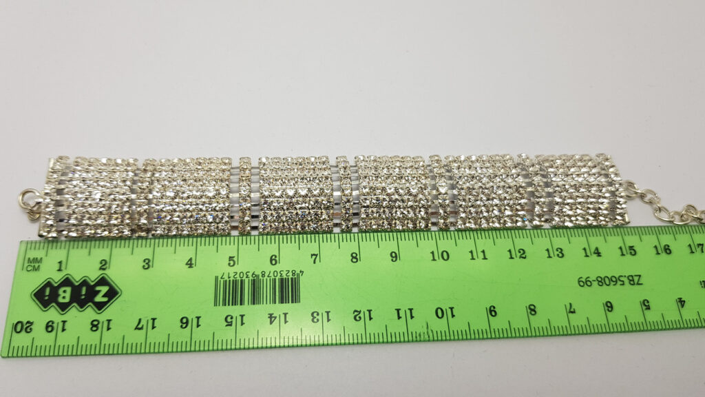 Браслет жіночий сріблястий з білими кристалами ширина 23 мм 8 рядів каменів