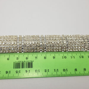 Браслет жіночий сріблястий з білими кристалами ширина 23 мм 8 рядів каменів