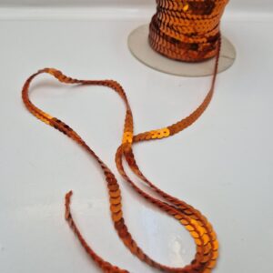 Паєтки на нитці, помаранчеві