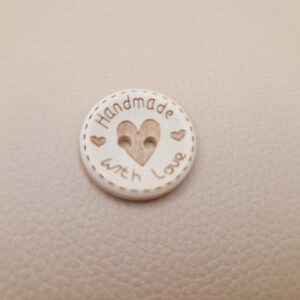 Гудзик з наскрізними отворами, діаметр 2.4 см (в наявності 2 розміри)